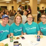 Attendees all in "I love writing" shirts